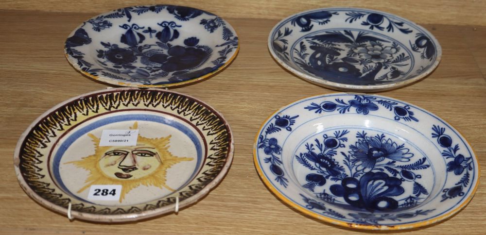 A collection of five 18th century Delft dishes, largest diameter 23cm